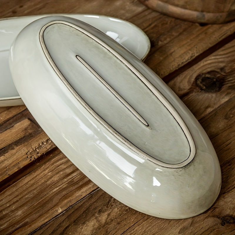 Assiette à poisson ovale vintage en céramique, finition émaillée à changement de cuisson, idéale pour une utilisation domestique, design durable et élégant