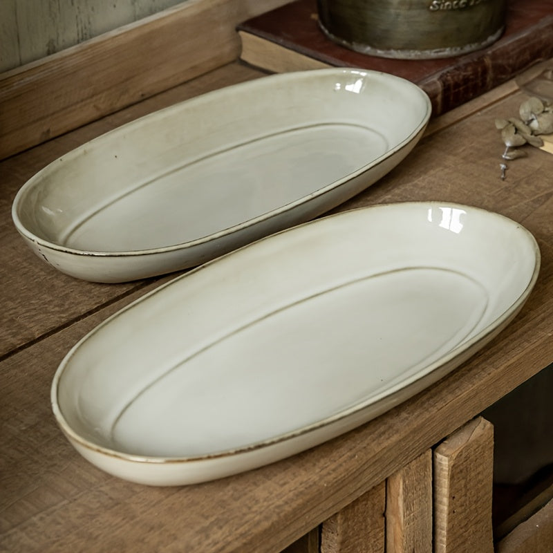 Assiette à poisson ovale vintage en céramique, finition émaillée à changement de cuisson, idéale pour une utilisation domestique, design durable et élégant