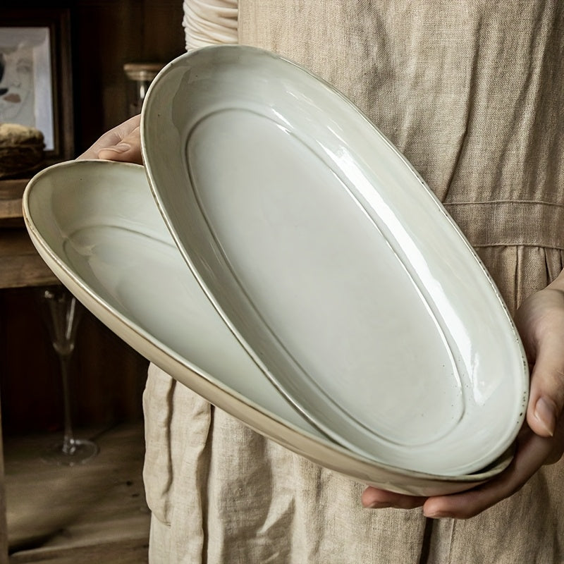 Assiette à poisson ovale vintage en céramique, finition émaillée à changement de cuisson, idéale pour une utilisation domestique, design durable et élégant